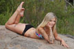 tattooed girl on rock