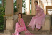 two girls in ao dai on steps