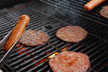 burgers and hot dogs on grill