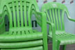 stacked green chairs