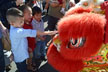 kids touch dragon's head