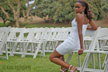 girl among rows of white chairs